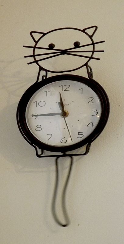 a clock my daughter in law gave me, the tail is a ...