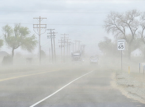 Wind-This was a dust storm that covered the road w...