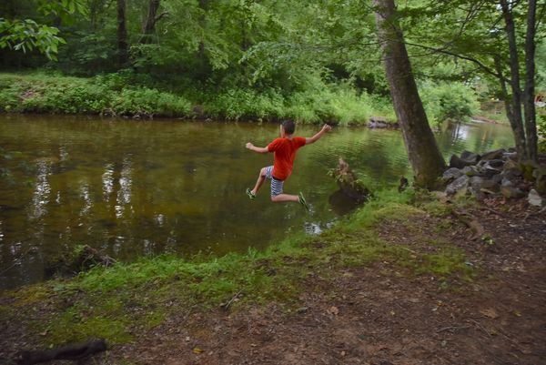 Jumping in the Nottely River behind our camper...