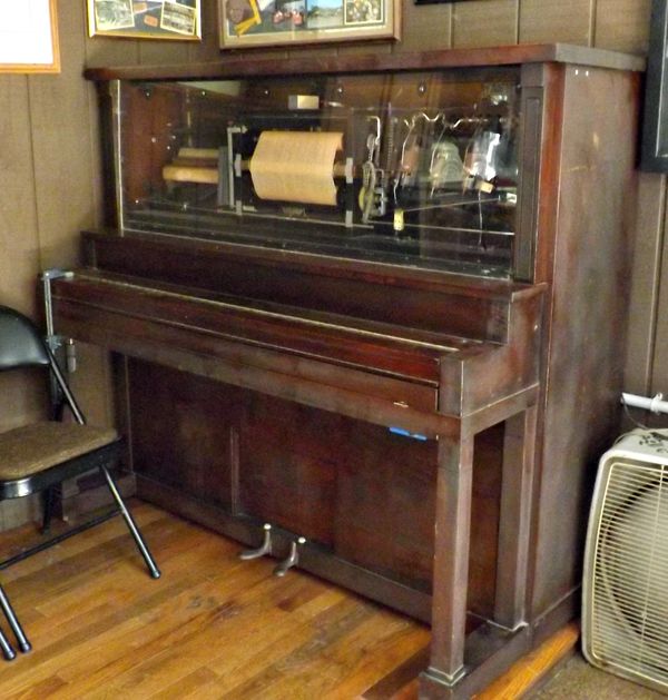player piano has a window...