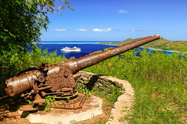 WWII canon on Bora Bora with my little ship in the...