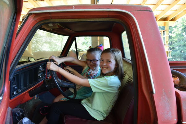 Ansley & Caroline checking out the cab of Grumpy's...