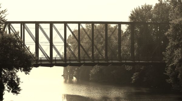 Bridge in the fog with a sepia filter...