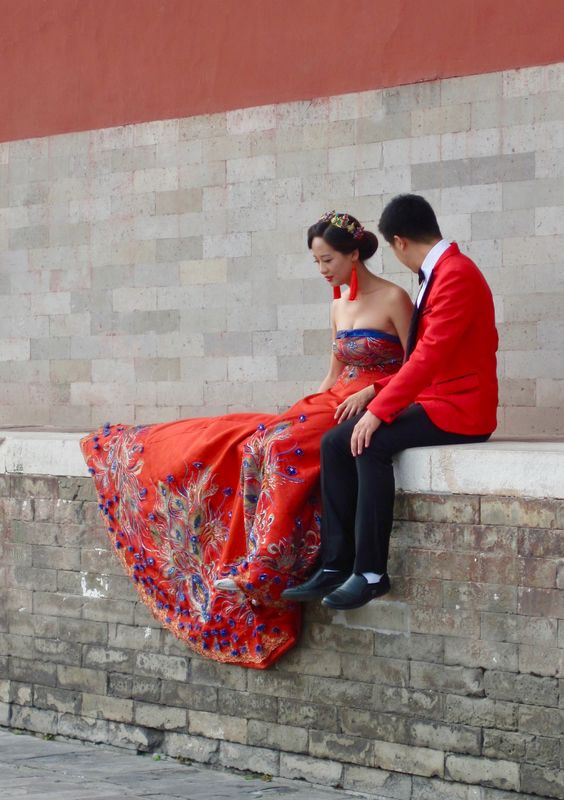 Chinese couple posing for photographer...