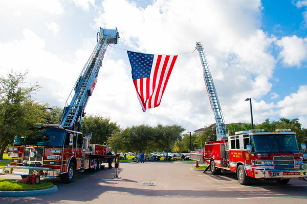 2 New Smyrna Beach Fire Department trucks salute V...