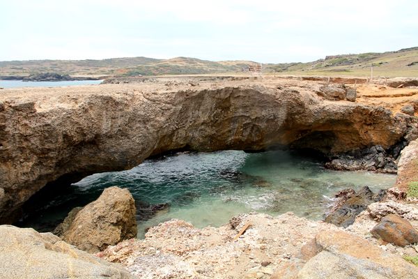 A "natural" bridge created by the waves of the oce...