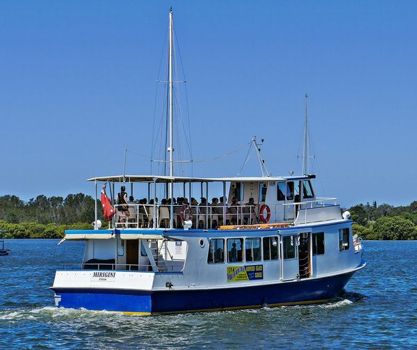 A fishing boat & a ferry The fishing boat was heading up the creek when I took this shot. The