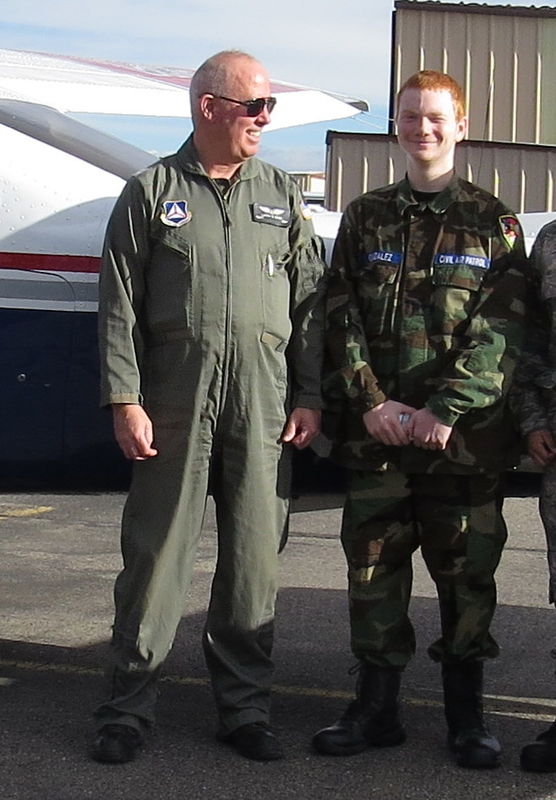Dakota's flying instructor looks  proud of him aft...