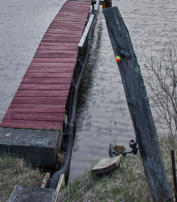 Red dock with a fishing pole at the ready....