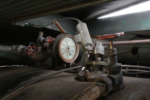 9. Steam pressure gauge mounted on top of the boil...
