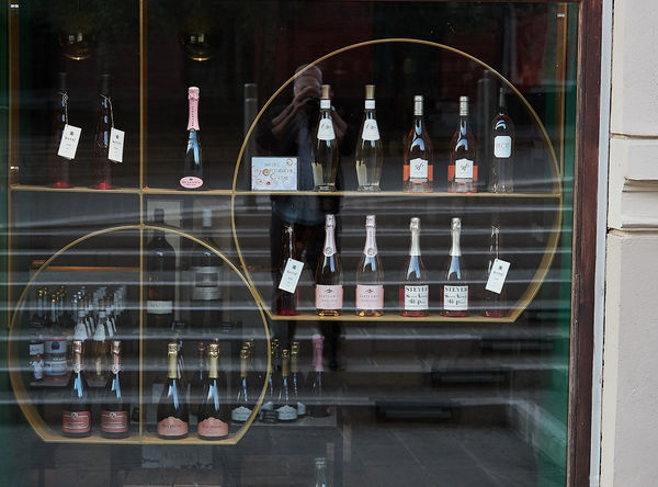 Drawn in by the geometry of this wine shop display...