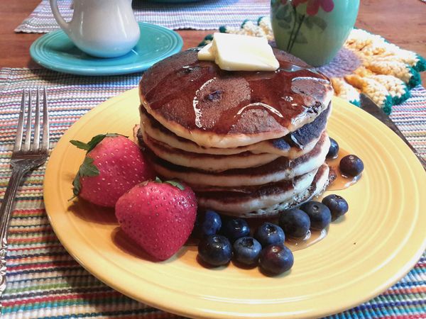 Blueberry buttermilk pancakes with fresh fruit...