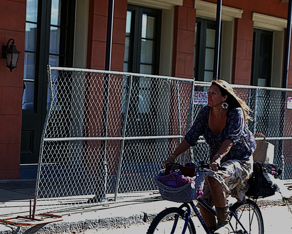 Woman riding her bike French Quarter, NOLA...