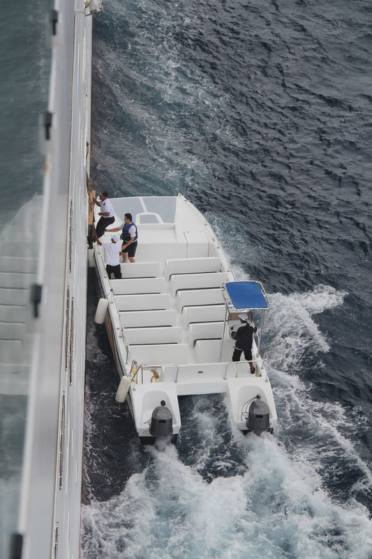 Port Pilots boarding our moving ship via a rope la...