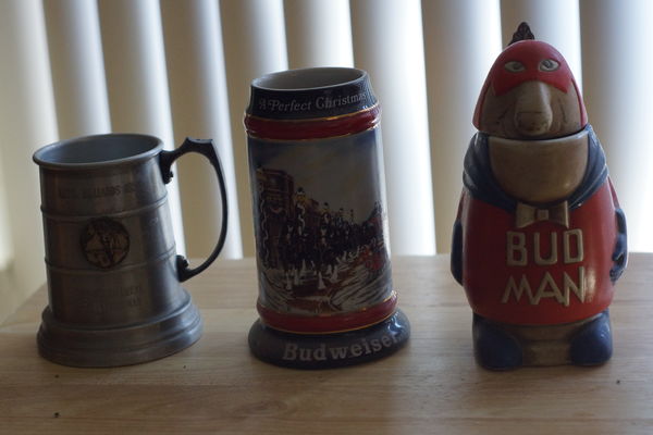 he 2 bud mugs are colectors items the one on the r...