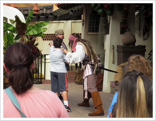 People watching Captain Jack Sparrow during a stre...