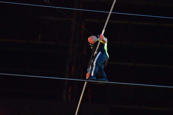 TS tightrope walker at night...