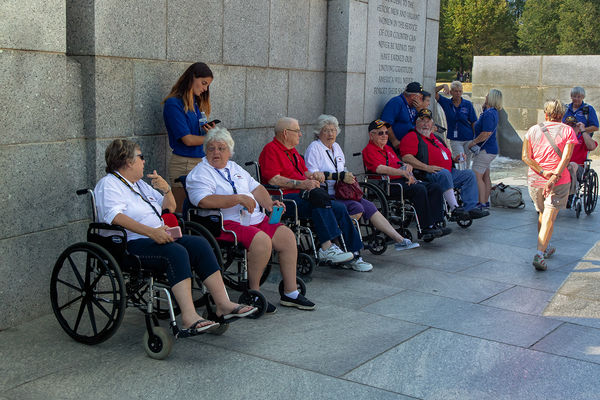 Men and Women veterans at the WWII memorial...