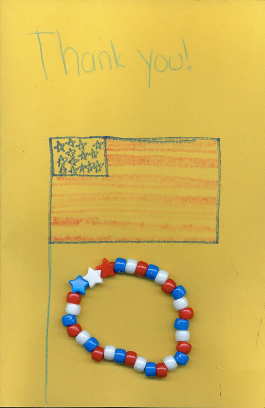 Card from a young child and bracelet made by local...