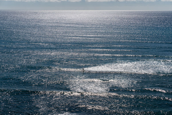 Lone surfer and the large ocean...