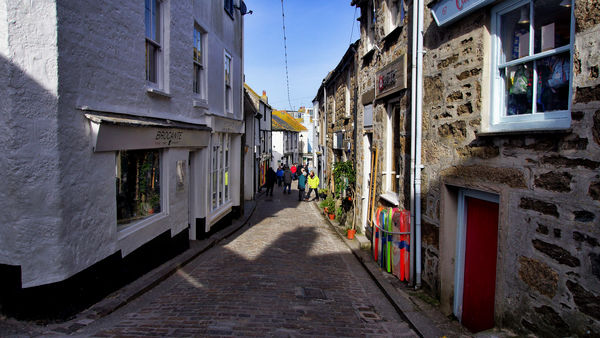 A typical narrow street with shops in St Ives....
