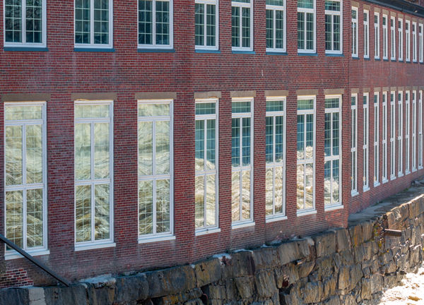 The waters reflected in the mill windows...