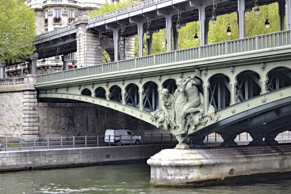 A bridge over the Seine in Paris, with the tireles...