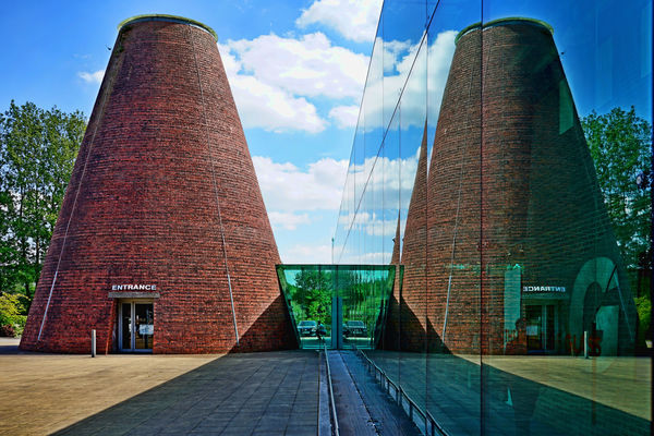 A reflection of the replica glass furnace and entr...