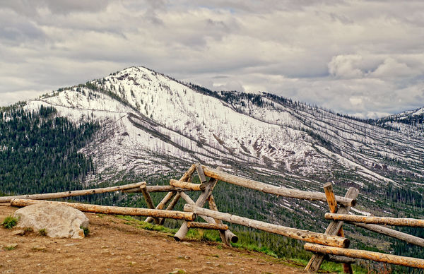 I just love these rustic fences with the mountains...