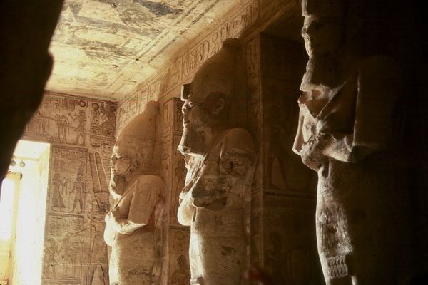 Eight 33' high statues of the god Osiris line a ha...