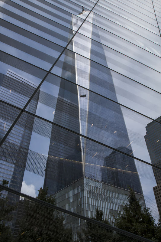 One World Trade Center reflected in glass of 9/11 ...