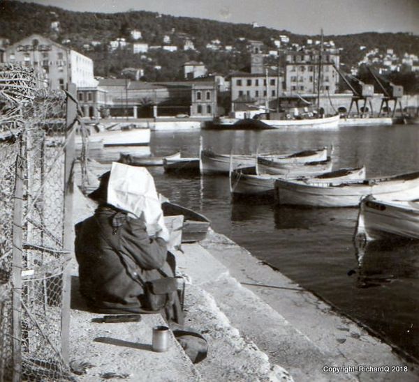 Artist at work (1946) on docks of the harbor of Ni...
