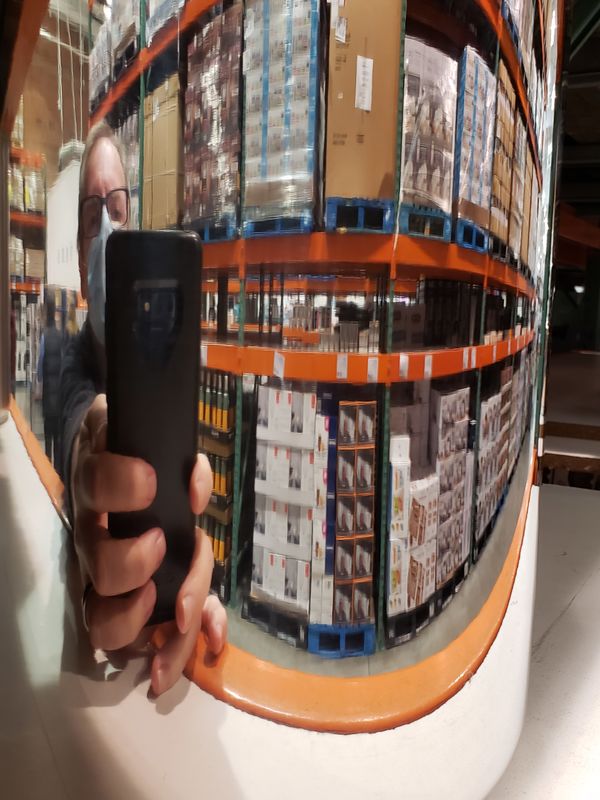 Reflection of a super store in a can of some sort ...