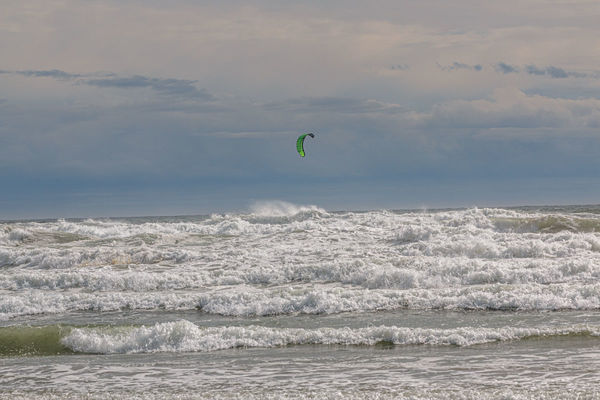 There's a windsurfer in the waves somewhere....