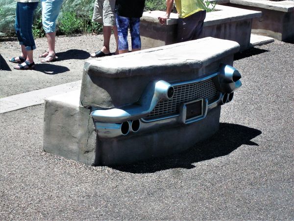 Bench decorated w/Cadillac?? bumper...