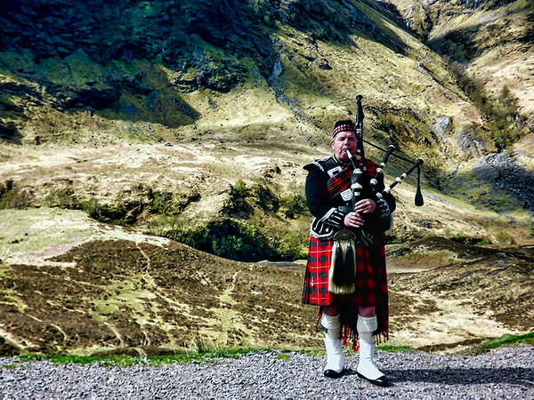 Scottish piper: a piper in Glencoe Scotland.