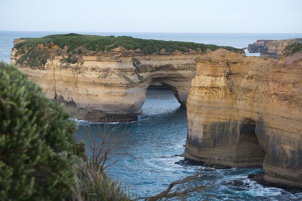 Cave has now cut through the headland forming a "L...