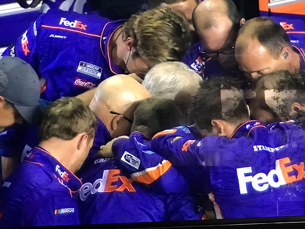 Joe Gibbs and his team in prayer after the end...