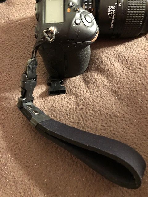Showing neck strap removed and replaced with wrist...