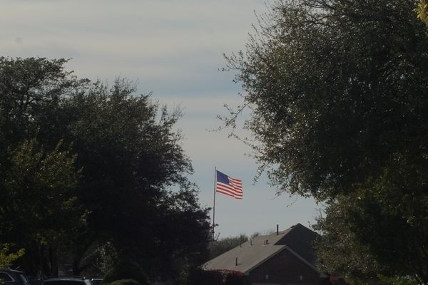 Old glory unfurled in the wind outside the neighbo...