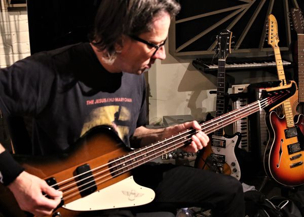 Tom playing his favorite Gibson Bass...