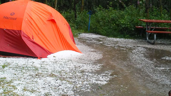 8. Hail piled against my tent & a stream running t...