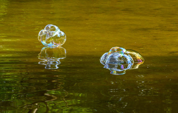 Bubbles bounced on the water...