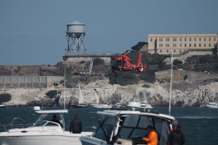 Coast Guard swimmer being retrieved...