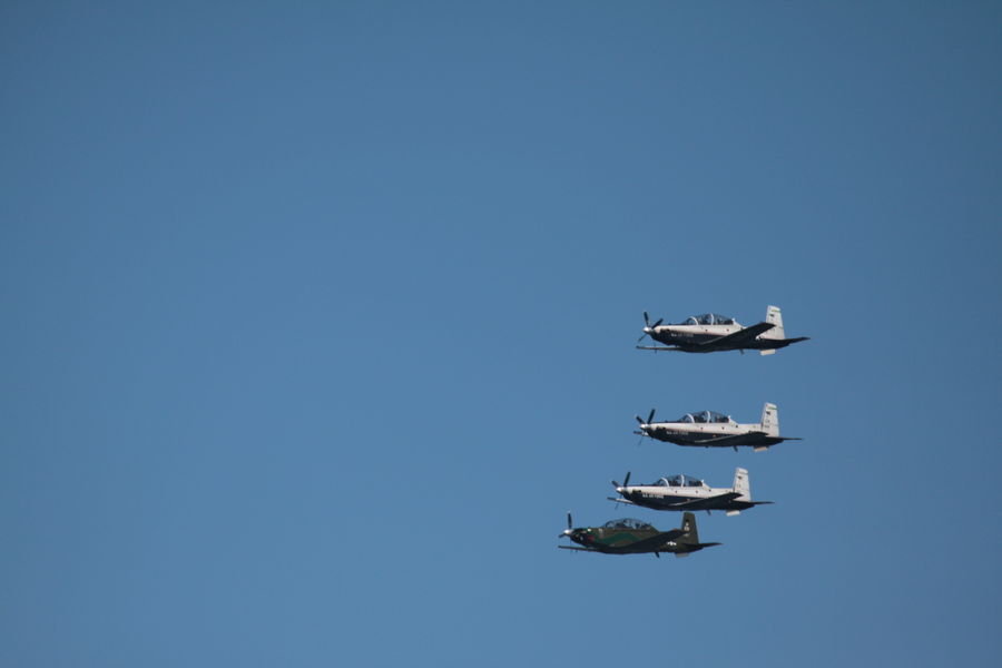 New T-6 Texans flying right to left from the 459th...