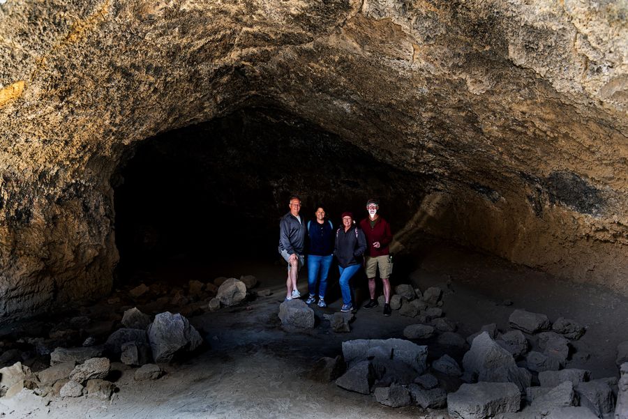 The four of us heading into the cave. Be sure to b...