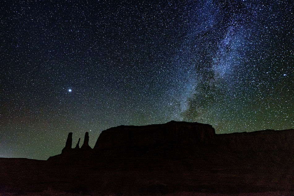 Milky Way rises over The 3 Sisters in Monument Val...