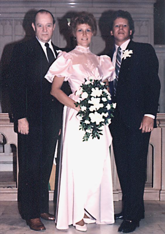 Sally's dad, Isaac, with Sally and me on our weddi...
