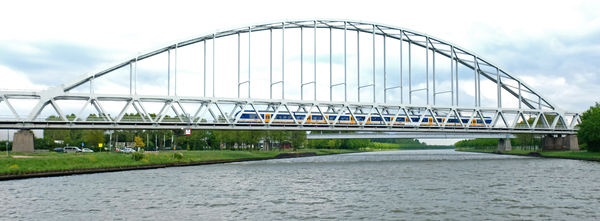 Arched railroad bridge over the Rhine River in Ger...
