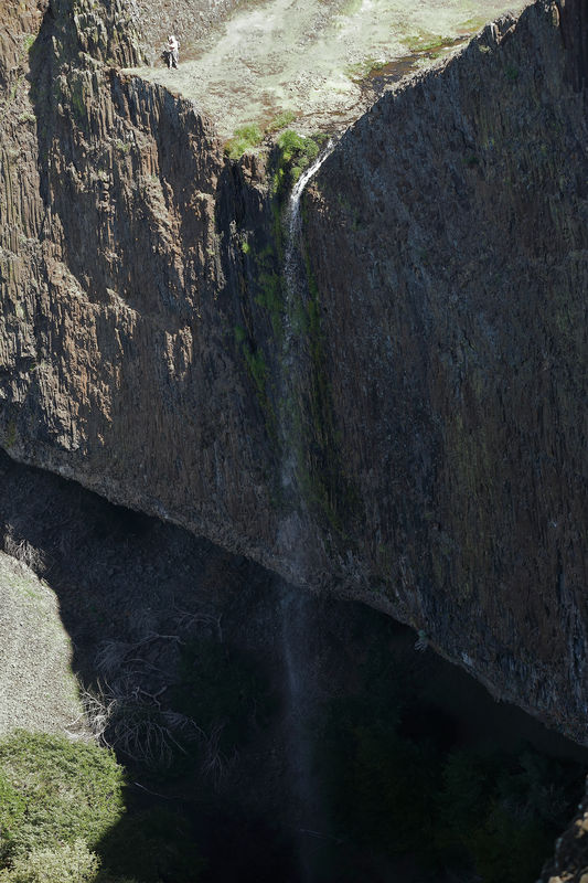 This shot shows a person near the top of the falls...